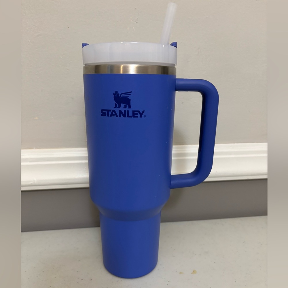 Stanley 40oz tumbler blue with handle and straw lid.